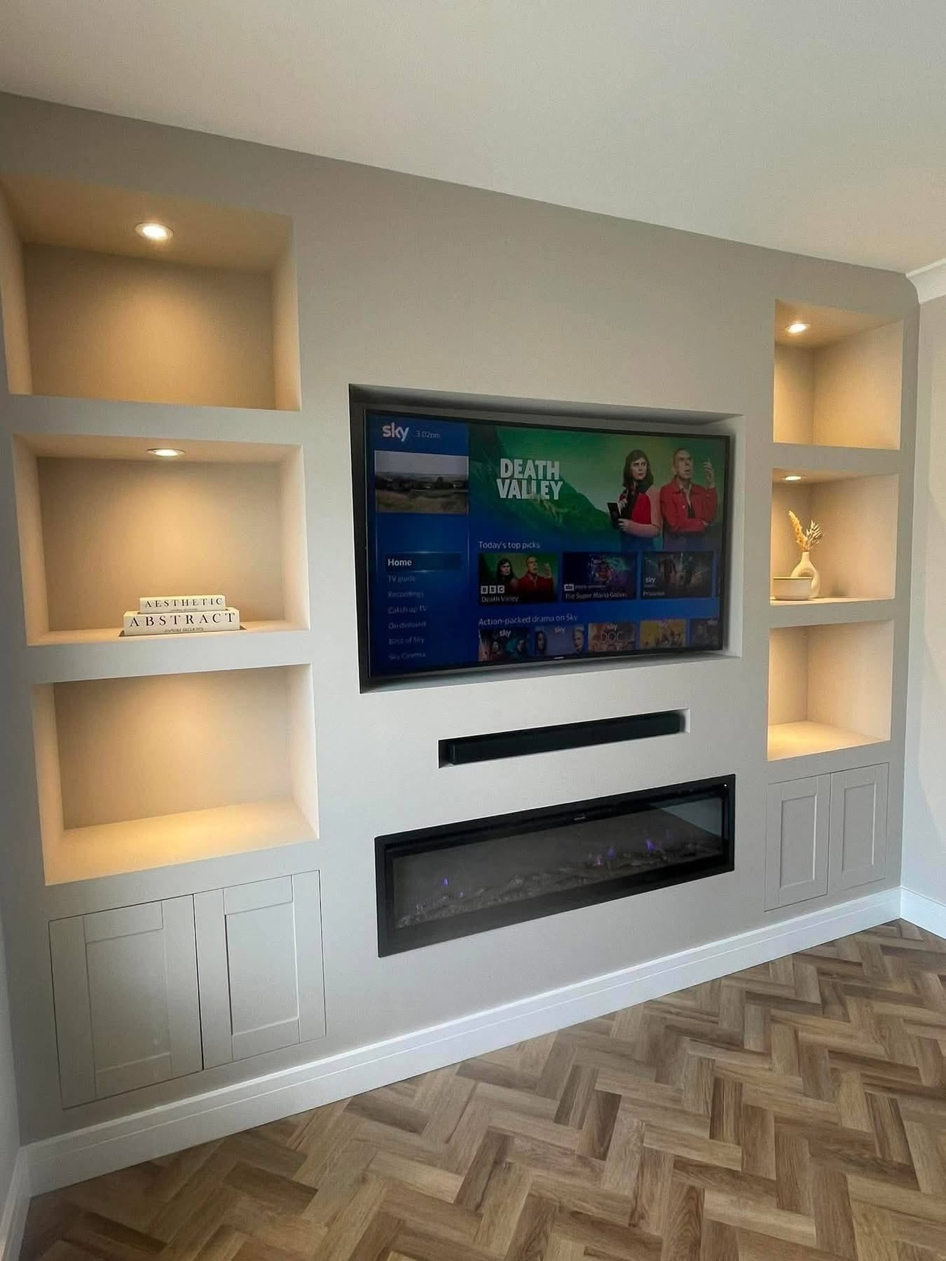 Recessed downlights installed within a fitted media wall feature alcove, electrical work by Morlec Electrical